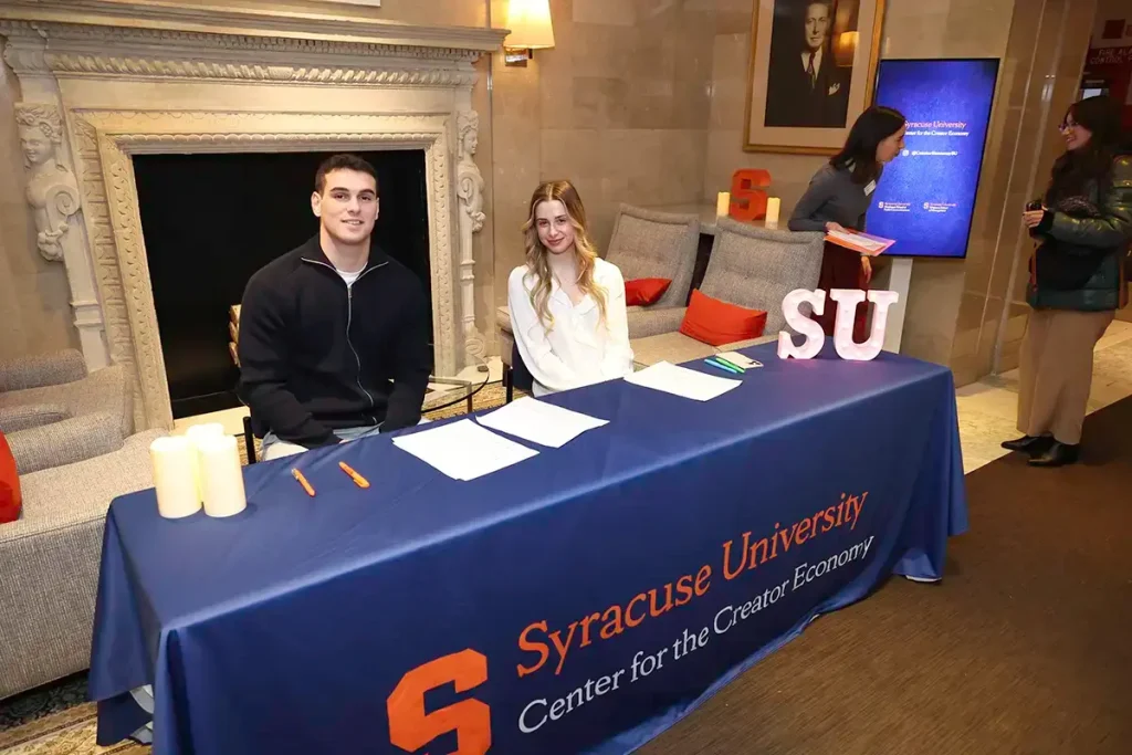 Students at a Center for the Creator Economy event check-in table